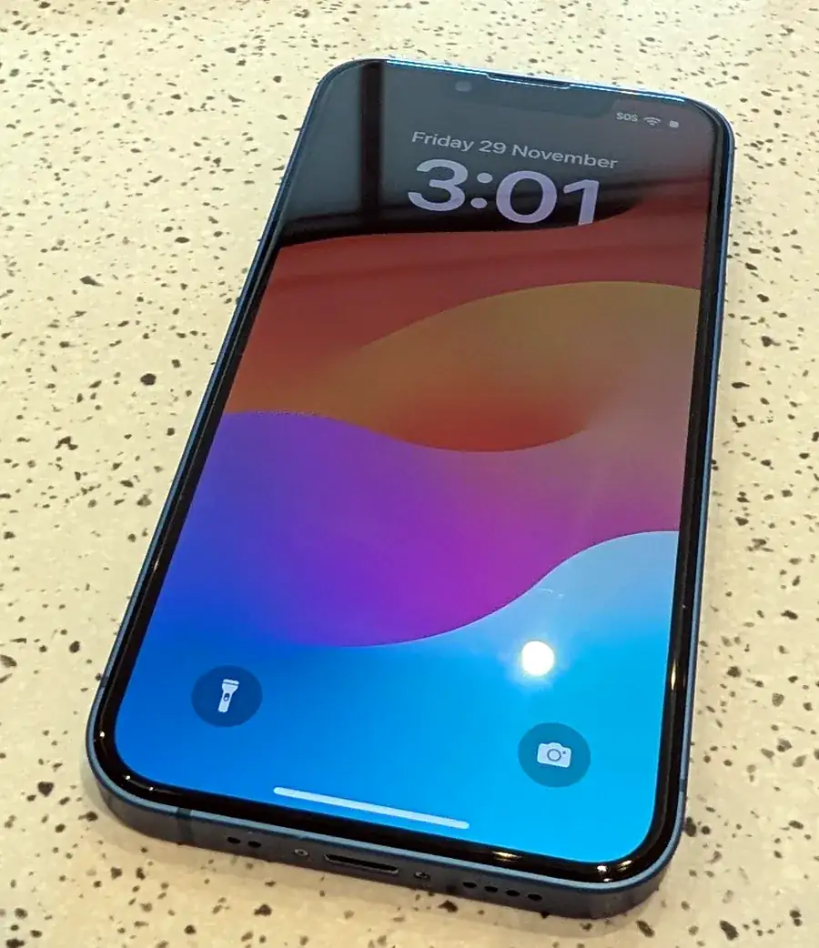 Repaired iPhone powered on and tested, ready for collection